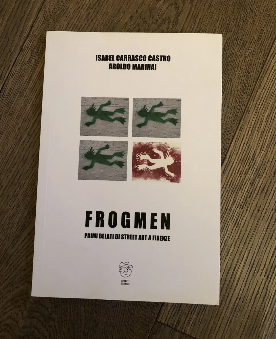 The ‘Frogmen’ book by Isabel Carrasco Castro and Aroldo Marinai displays four frog stencils on the cover, highlighting the first street art wave in Florence.