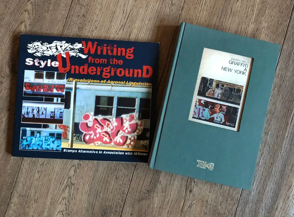 The books ‘Style: Writing from the Underground’ and ‘Graffiti a New York’ sit side by side, underscoring graffiti links between Italy and New York.